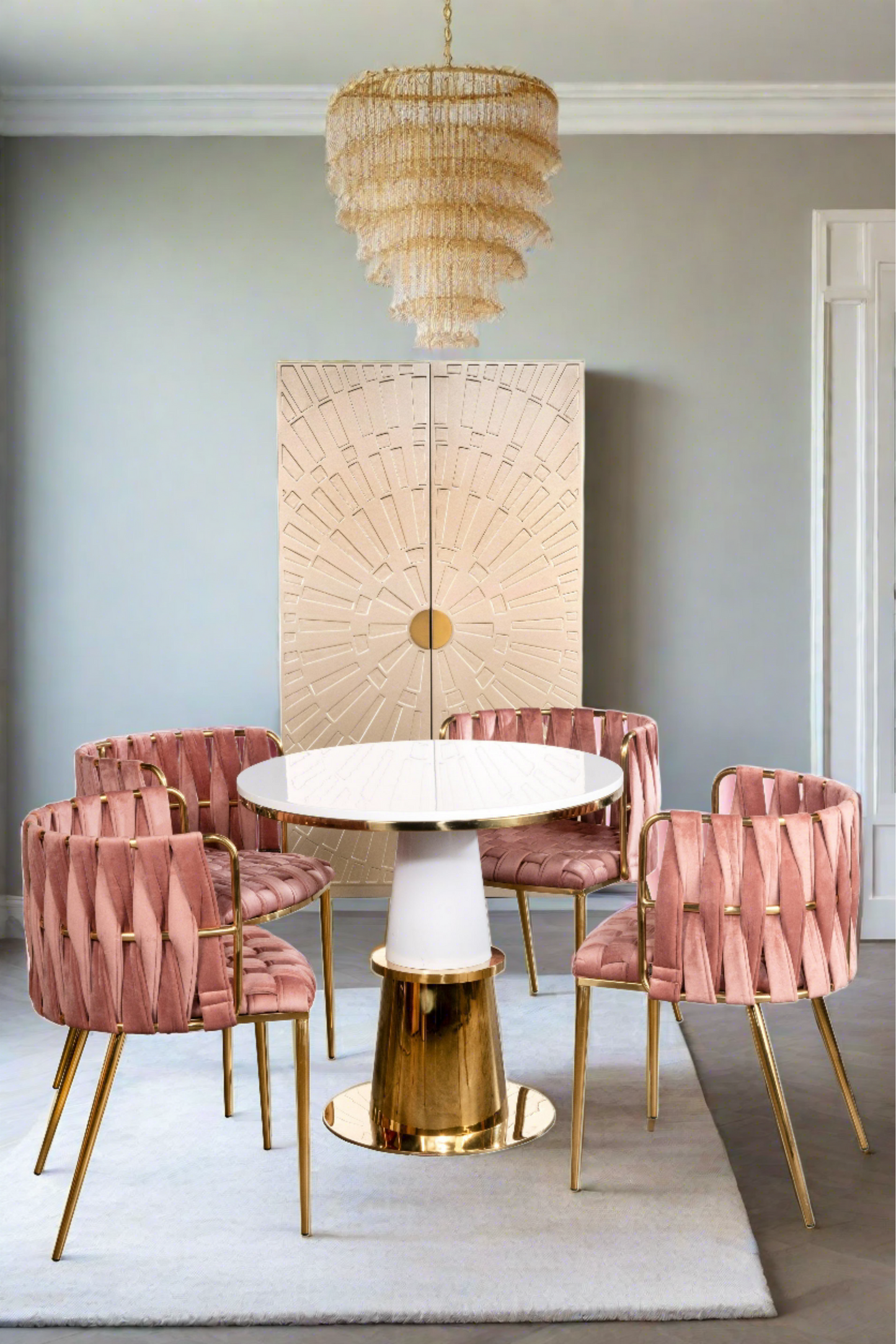 gold and white round dining table with rose chairs