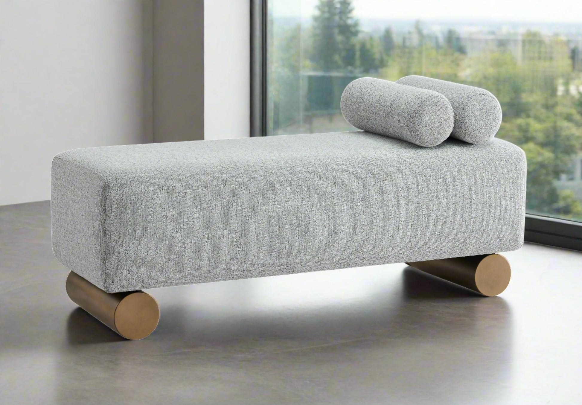 gray bench with tube pillows