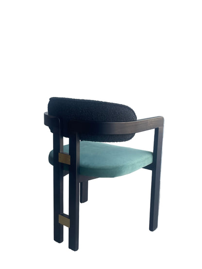 chair with black frame and teal cushion
