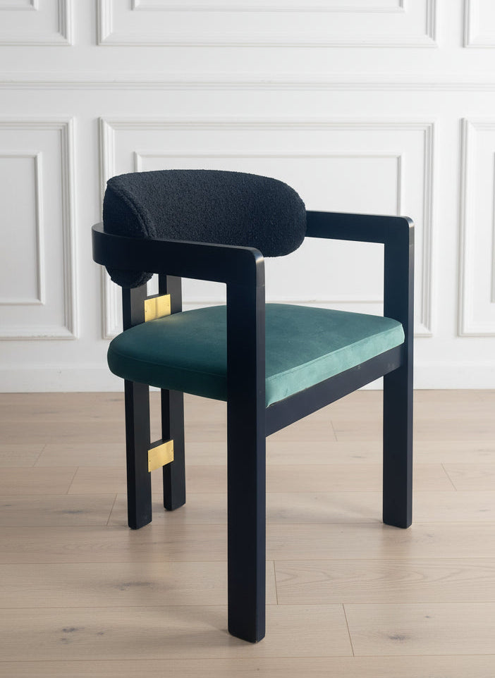 Chair with teal cushion and black frame ag