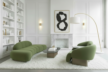 Modern living room with green sofa and armchair on a white rug, featuring a fireplace and wall lights.