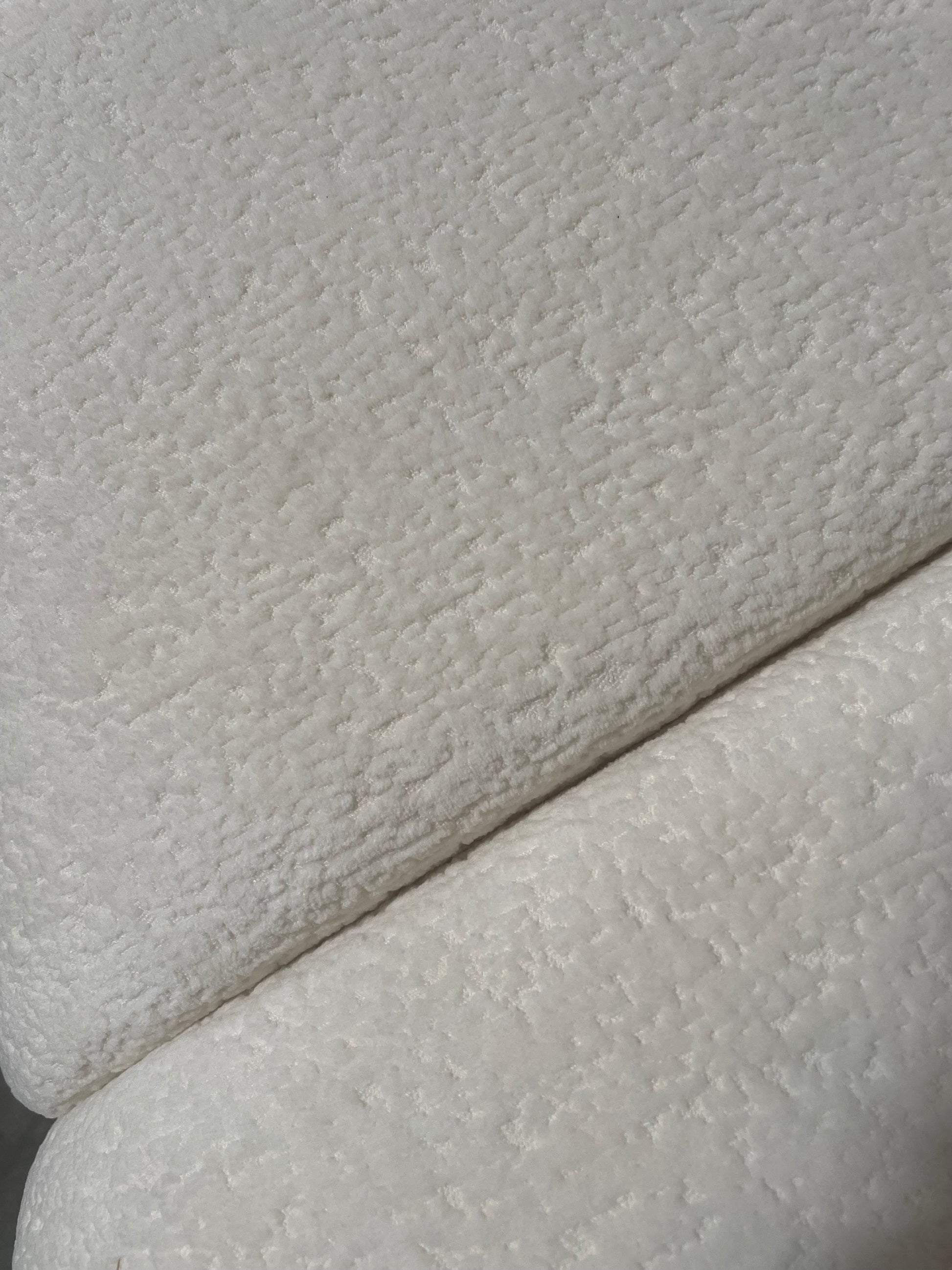 Close-up of textured white fabric for le croissant sofa